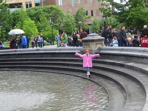 girl_in_pink_raincoat_in_the_fountain_washington_square_park_greenwich_village_1